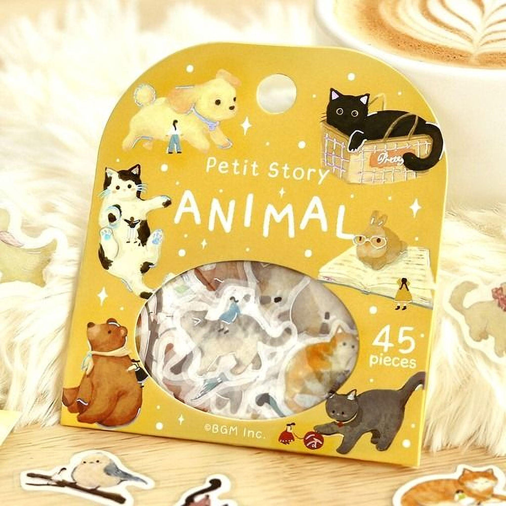 a yellow package with a collection of animal stickers, including a dog, cat, rabbit, and bear, along with a small bird sticker.