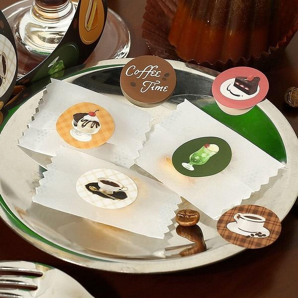 A plate with various food items, including a cupcake, a cookie, and a coffee cup, along with a sign that says "Coffee Time".