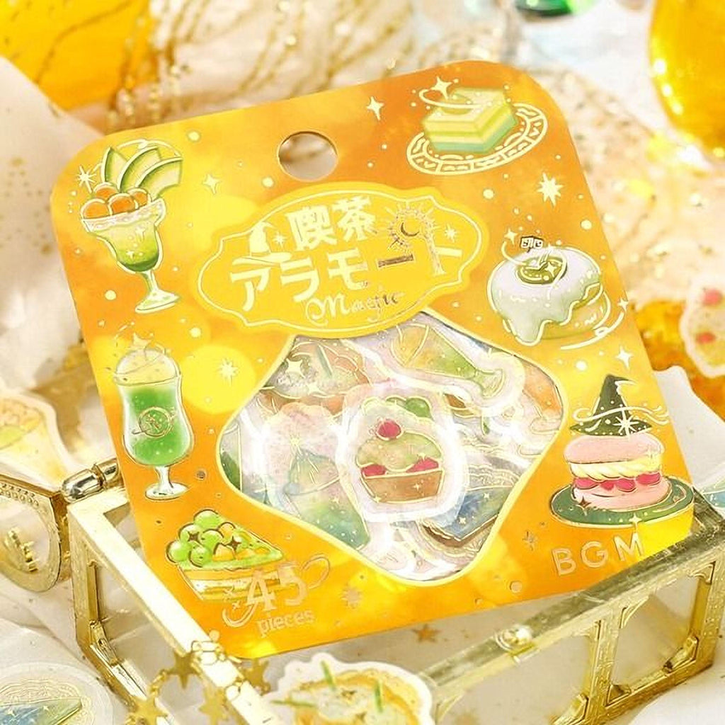 a package of stickers with various food items and desserts, including a cake, cupcakes, and fruit.