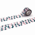 a roll of patterned tape with a repeating floral design in shades of pink and green.