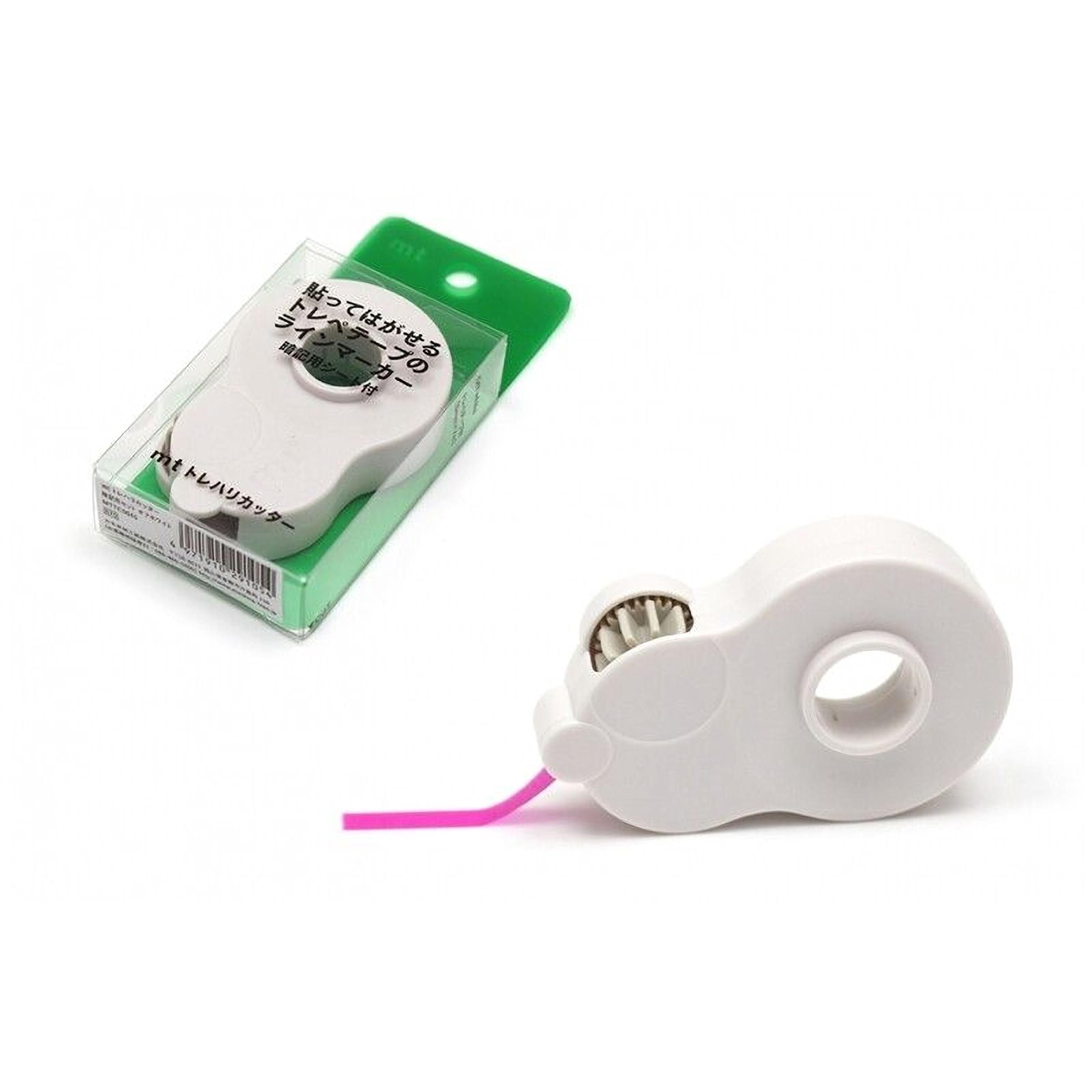 a white plastic object, possibly a stapler or stapler remover, with a pink plastic piece attached to it. The object is placed next to its packaging, which is a clear plastic box with Japanese text on it.