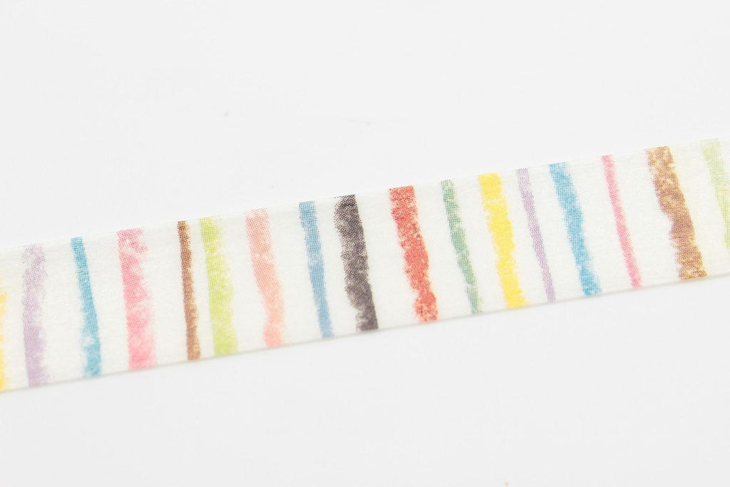 A white object with a striped pattern of various colors, including red, orange, yellow, green, blue, and purple.