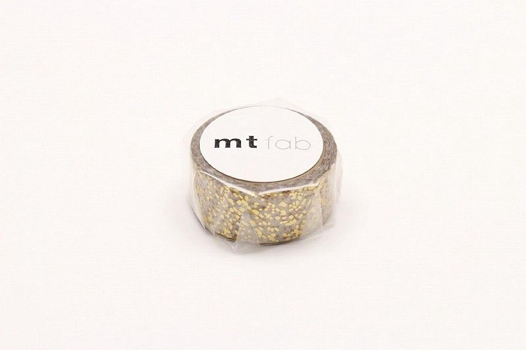 A roll of gold glittery tape with the label "mt lab" printed on it.