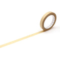 A roll of yellow tape is lying on its side on a white background.