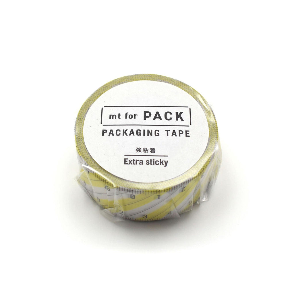 A roll of yellow and white tape labeled "mt for PACK" and "PACKAGING TAPE" with the text "Extra sticky" printed on it.