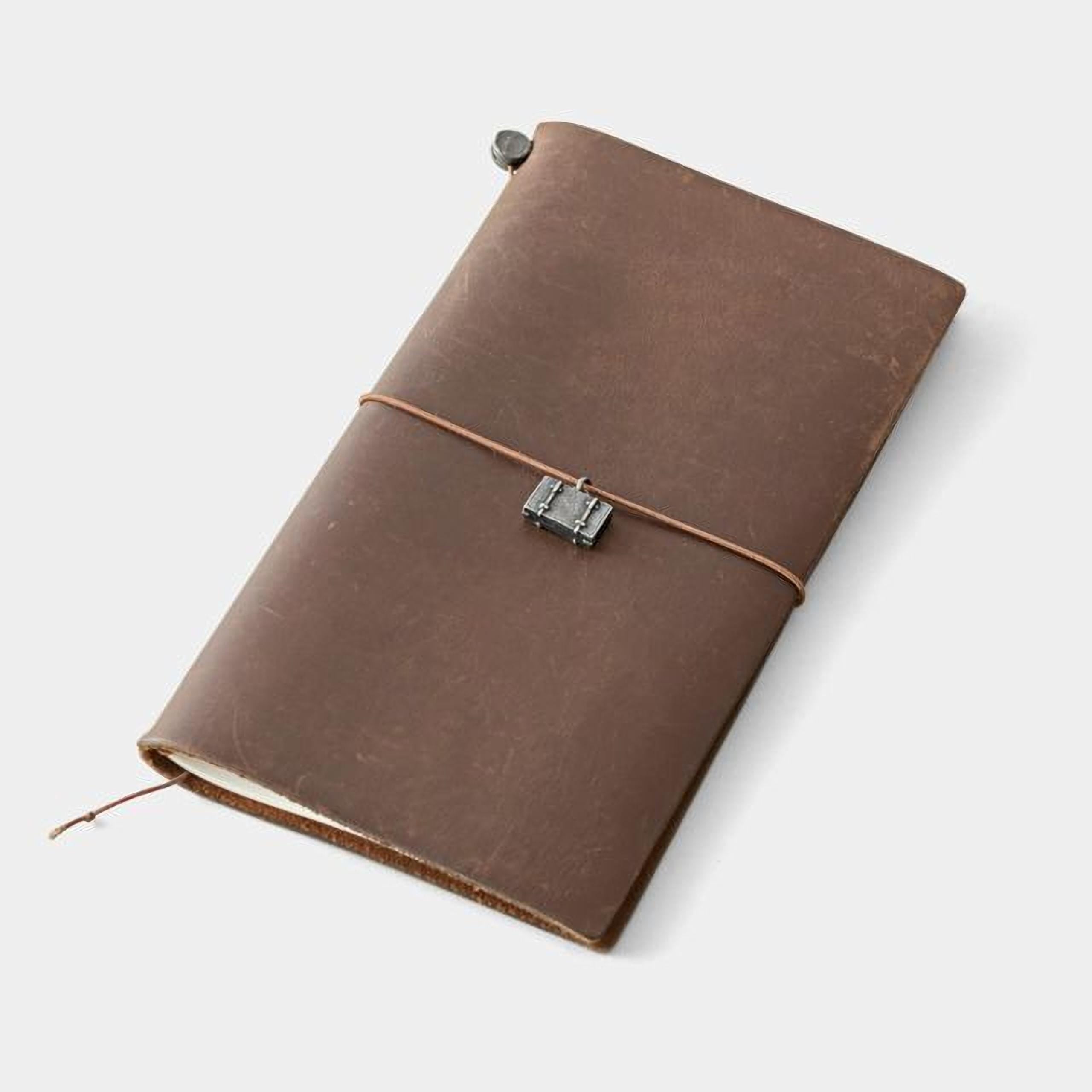 A brown leather-bound notebook with a metal clasp and a leather strap.