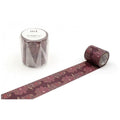 a roll of maroon patterned tape with a floral design, and a clear plastic container with the same floral design on it.