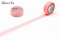 two rolls of pink and white polka dot tape on a white background.