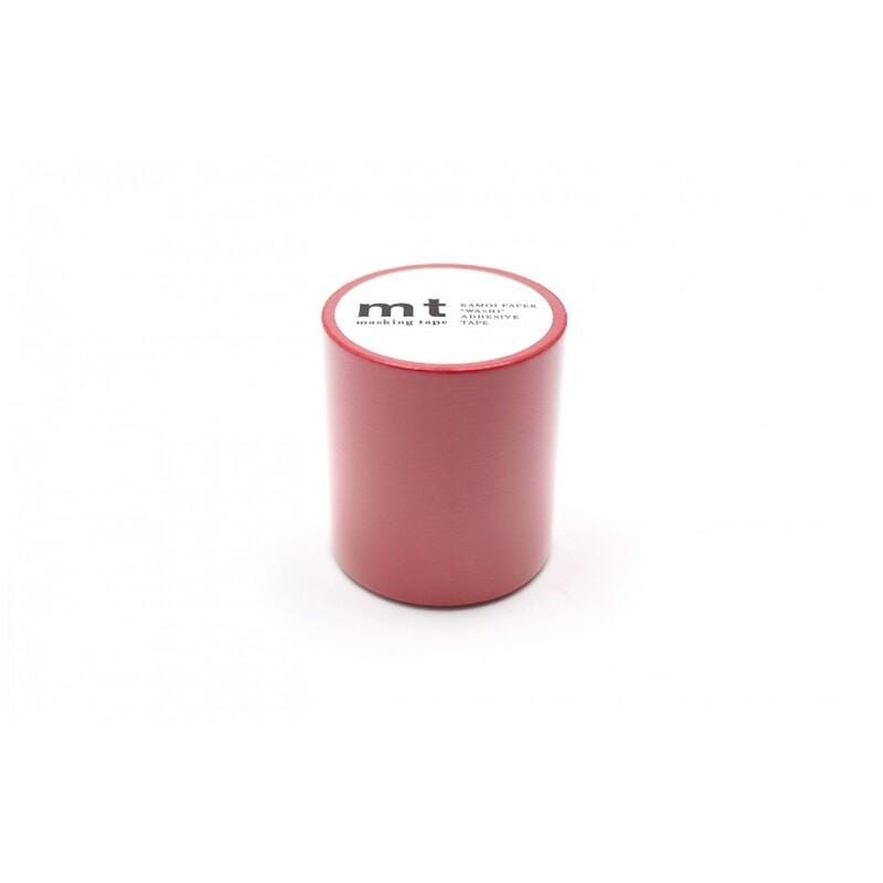 A red cylindrical container with a white label on it, sitting on a white background.