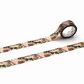 a roll of patterned tape with a design of sunglasses and other objects, such as a clock and a bird, on it.