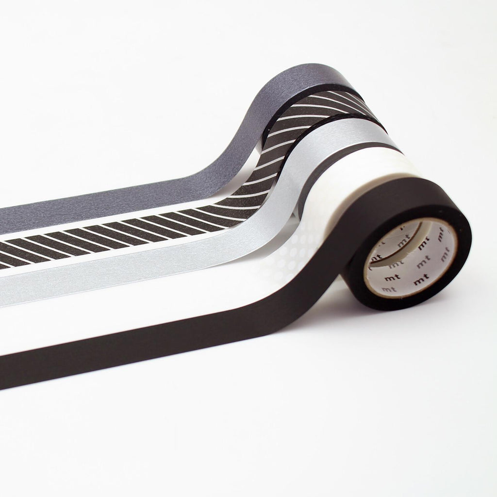 A roll of black, white, and gray metallic tape is shown against a white background.