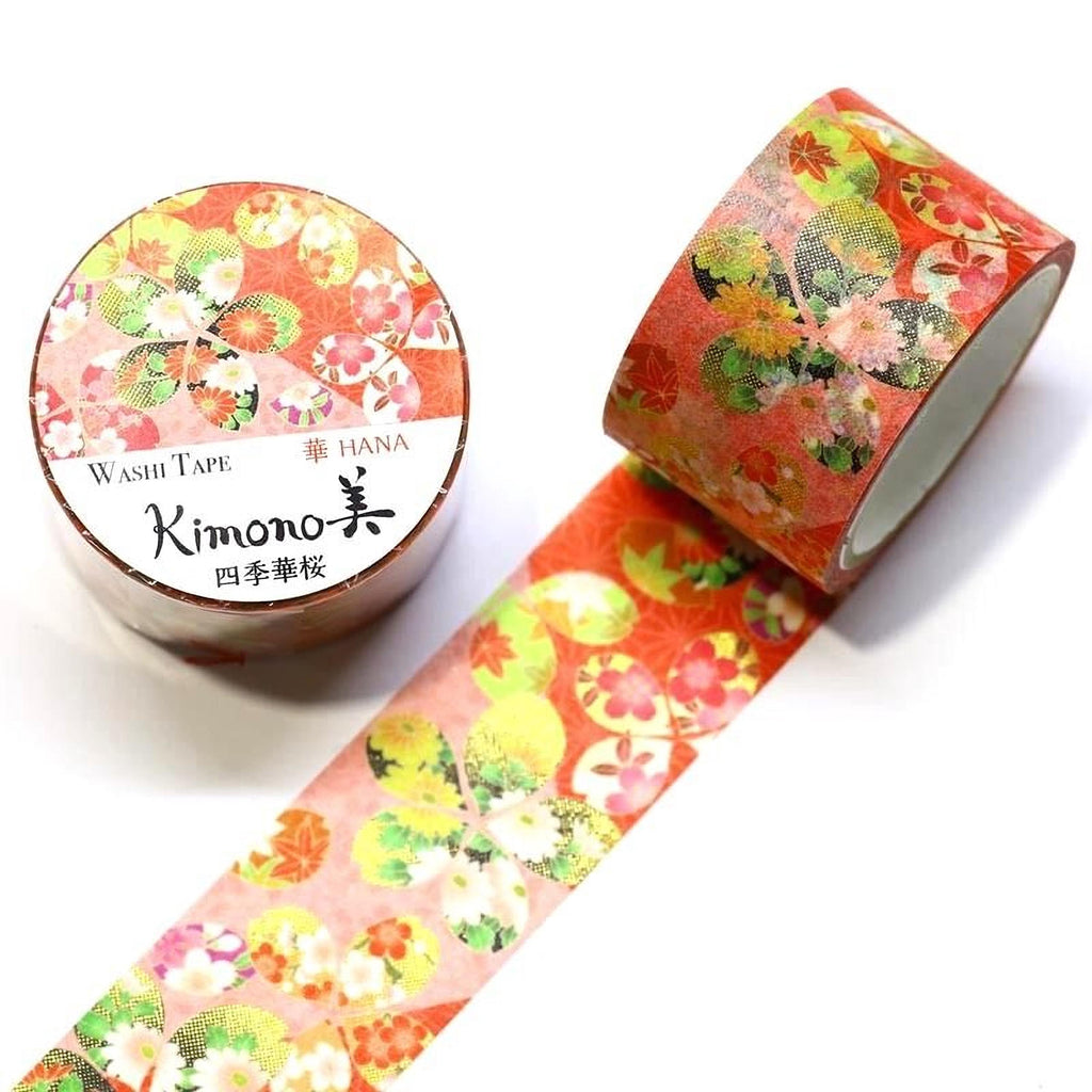 a roll of washi tape with a floral pattern and a round container with a label that reads "KIMONO WASHI TAPE HANA".
