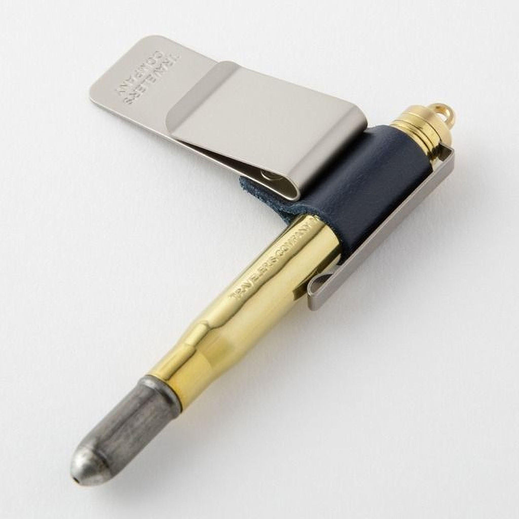 A bullet-shaped pen with a clip and a metal clip attached to it.