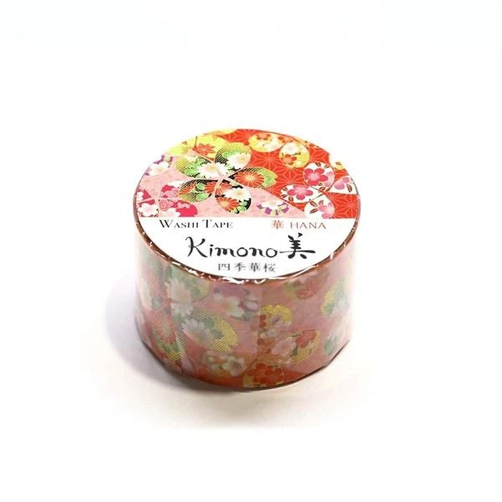 A cylindrical container with a floral pattern and text on it, which appears to be a product of the brand Kimono.