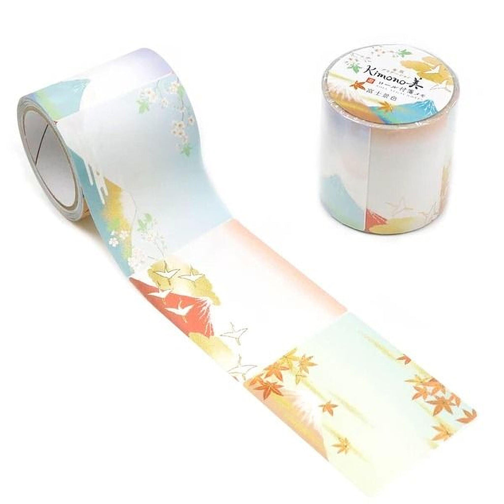 a roll of decorative tape with a colorful, nature-inspired design, including images of mountains, leaves, and birds.
