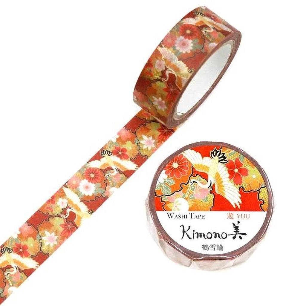 a roll of washi tape with a floral pattern and a round label with Japanese text.