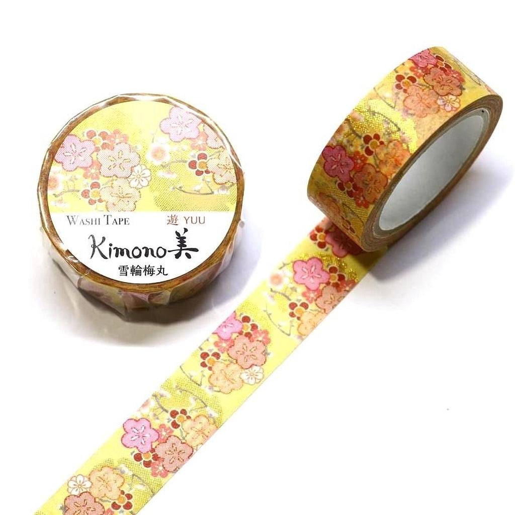 a roll of yellow and pink floral patterned washi tape and a round yellow and pink floral patterned washi tape roll.