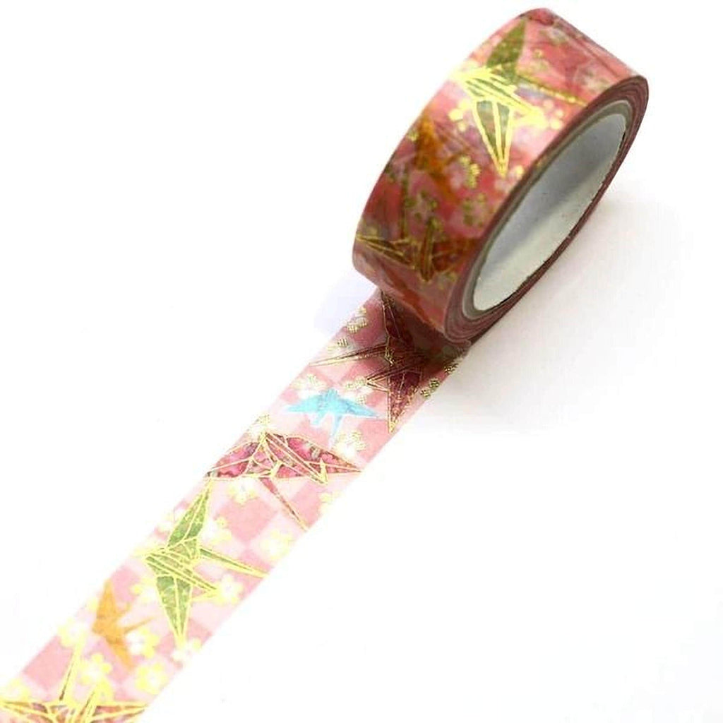 A roll of pink and red metallic tape with a pattern of green and yellow stars is shown against a white background.