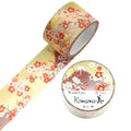 a roll of washi tape with a floral pattern and a round lid with Japanese text on it.