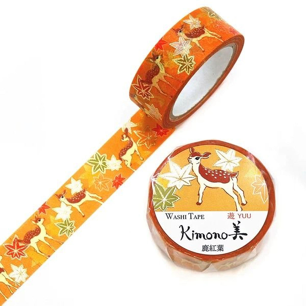 a roll of washable tape with a pattern of deer and leaves, and a round label with the text "YUU Kimono" and an illustration of a deer.