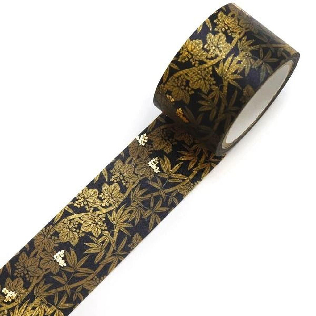 A roll of black and gold patterned tape with a leafy design.