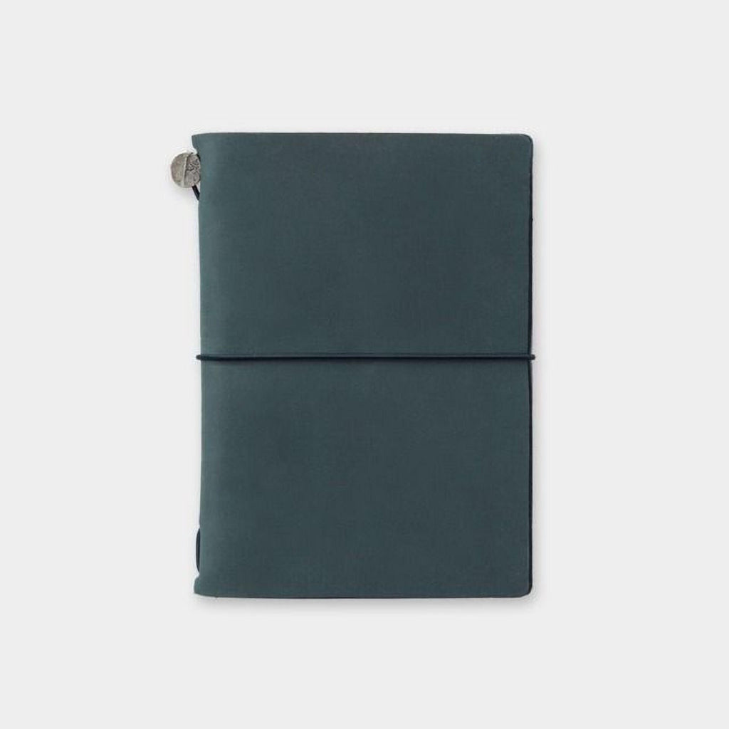 a dark green, rectangular-shaped notebook or journal with a black band around the top edge.