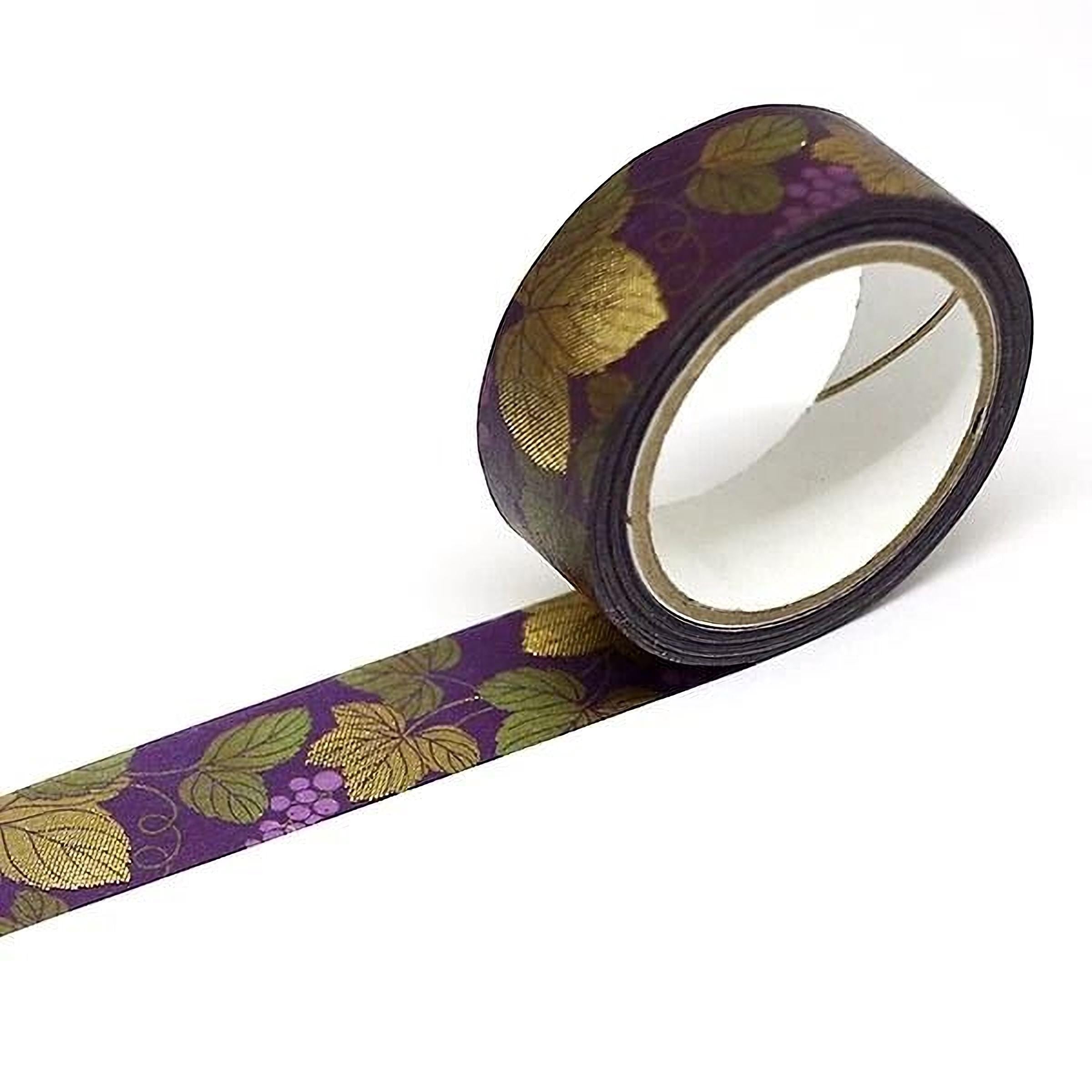 A roll of purple and gold patterned tape with a leaf design on it.