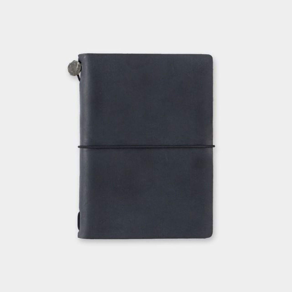 A black leather-bound notebook with a metal clasp on the top left corner.