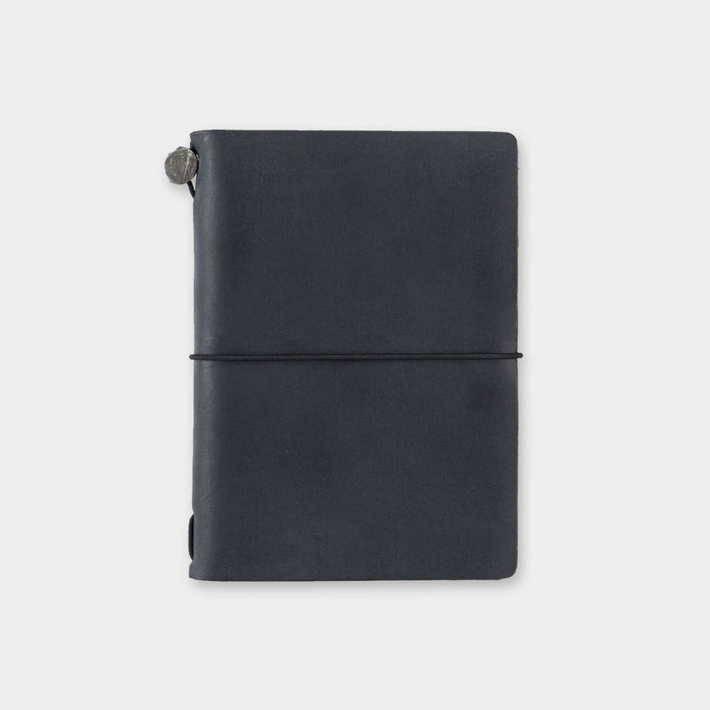 A black leather-bound notebook with a metal clasp on the top left corner.