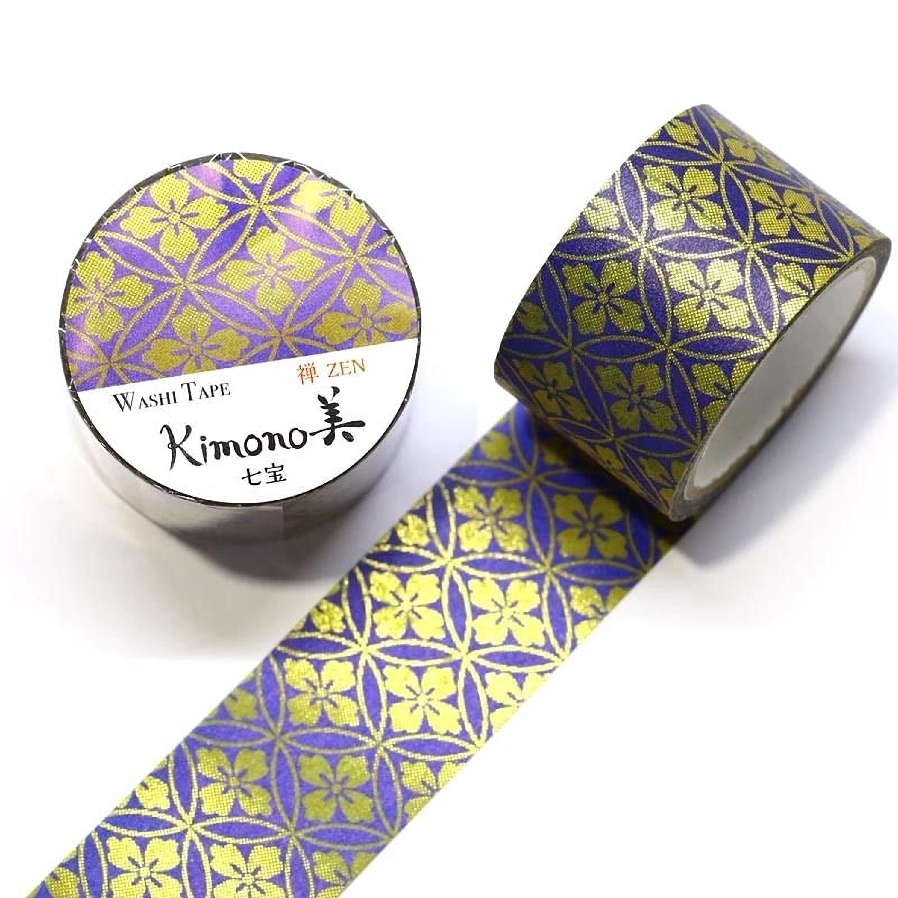 a roll of washi tape with a floral pattern in shades of purple and gold, and a second roll of washi tape with a similar pattern.