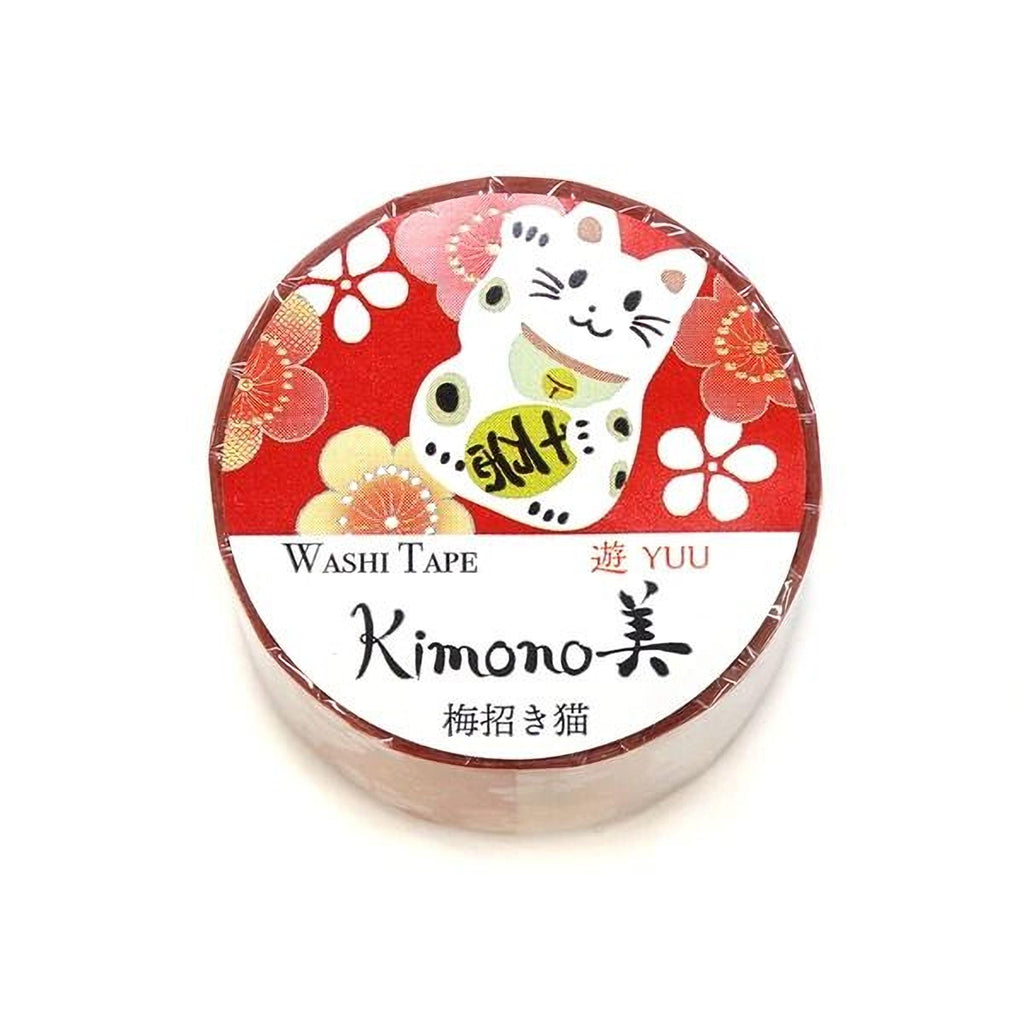 A round, red and white roll of washi tape with a cat design on it.