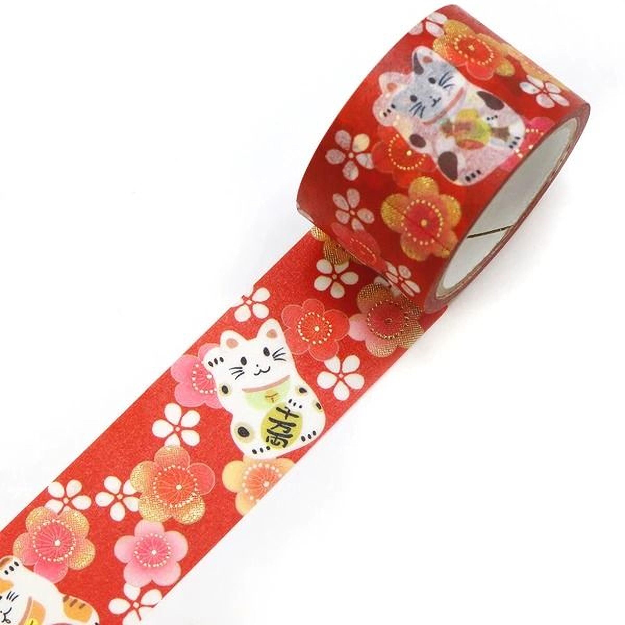 A roll of red tape with a floral pattern and images of cats printed on it.