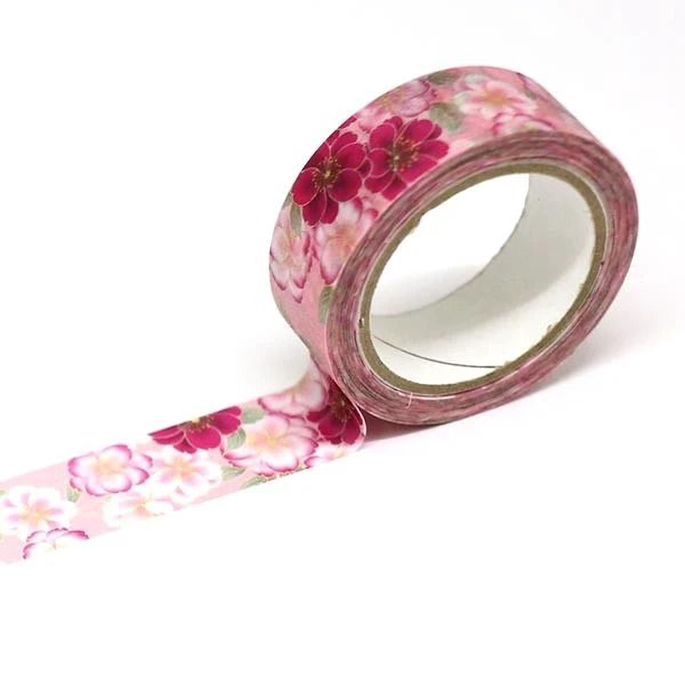 A pink floral patterned tape roll is shown against a white background.
