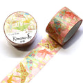 a roll of pink and gold washi tape with a decorative pattern of origami birds on it, along with a round container of the same type of tape.