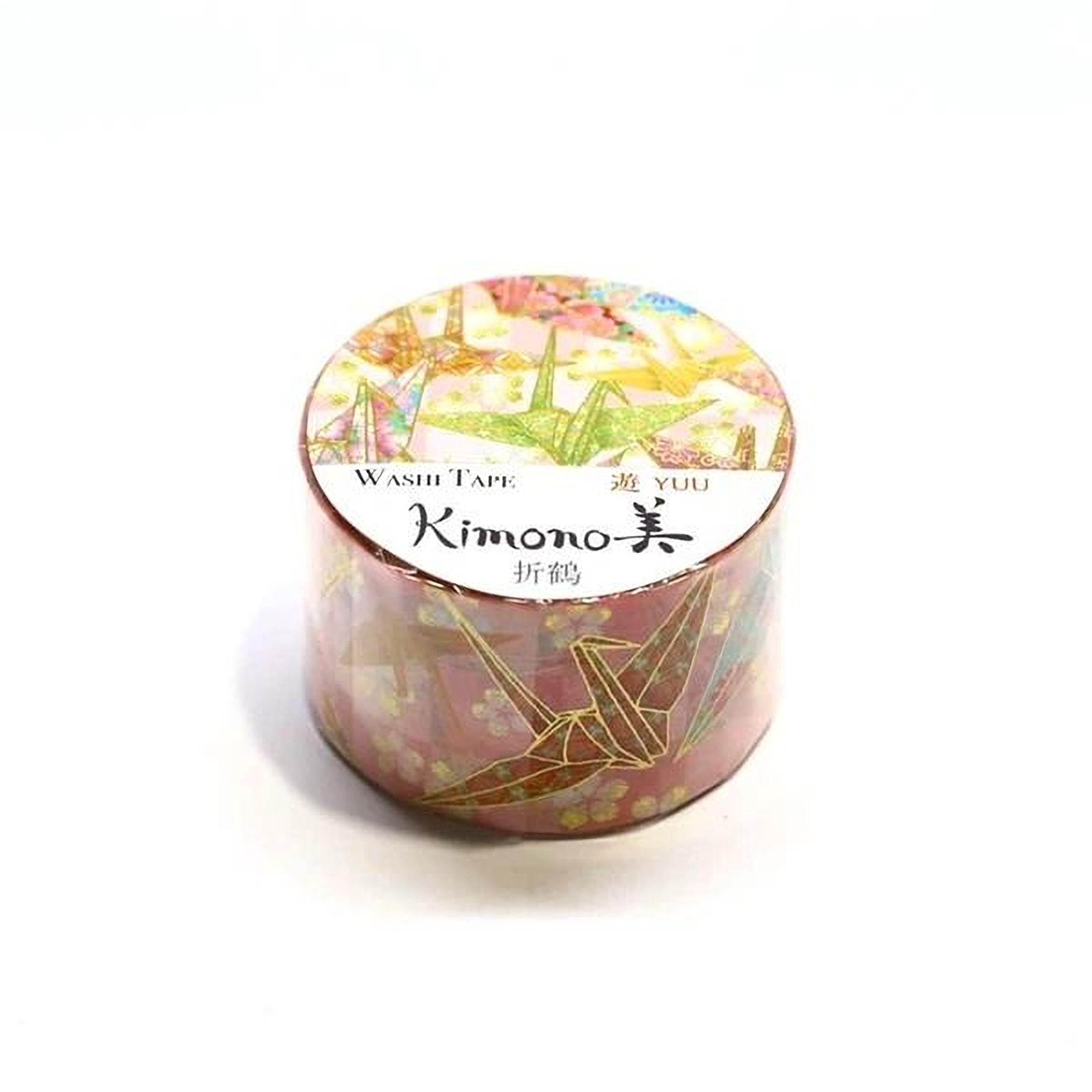 A cylindrical container with a colorful, patterned design on it, featuring a label that reads "Washi Tape Kimono" and "YUO".