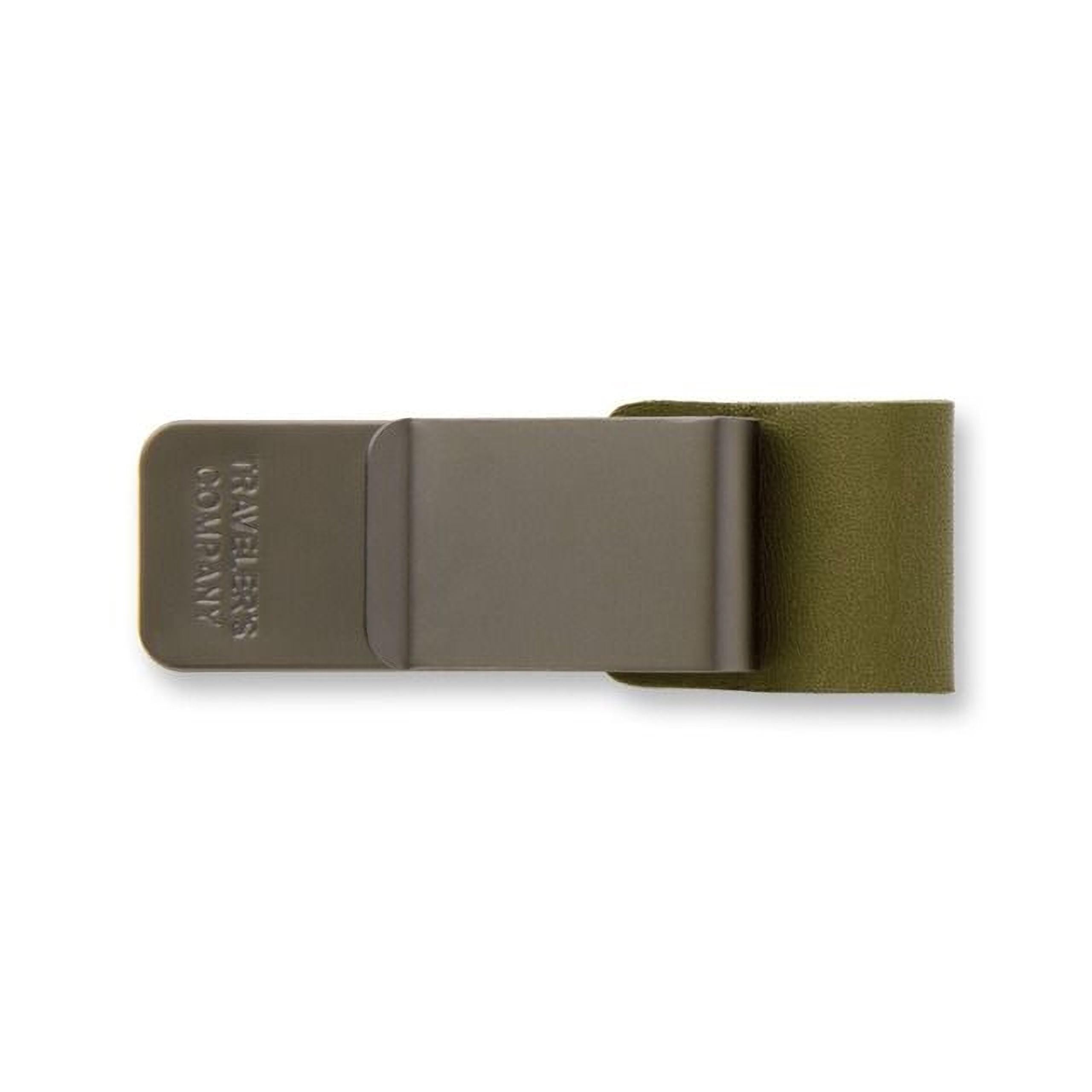 A grey metal money clip with a green leather cover.