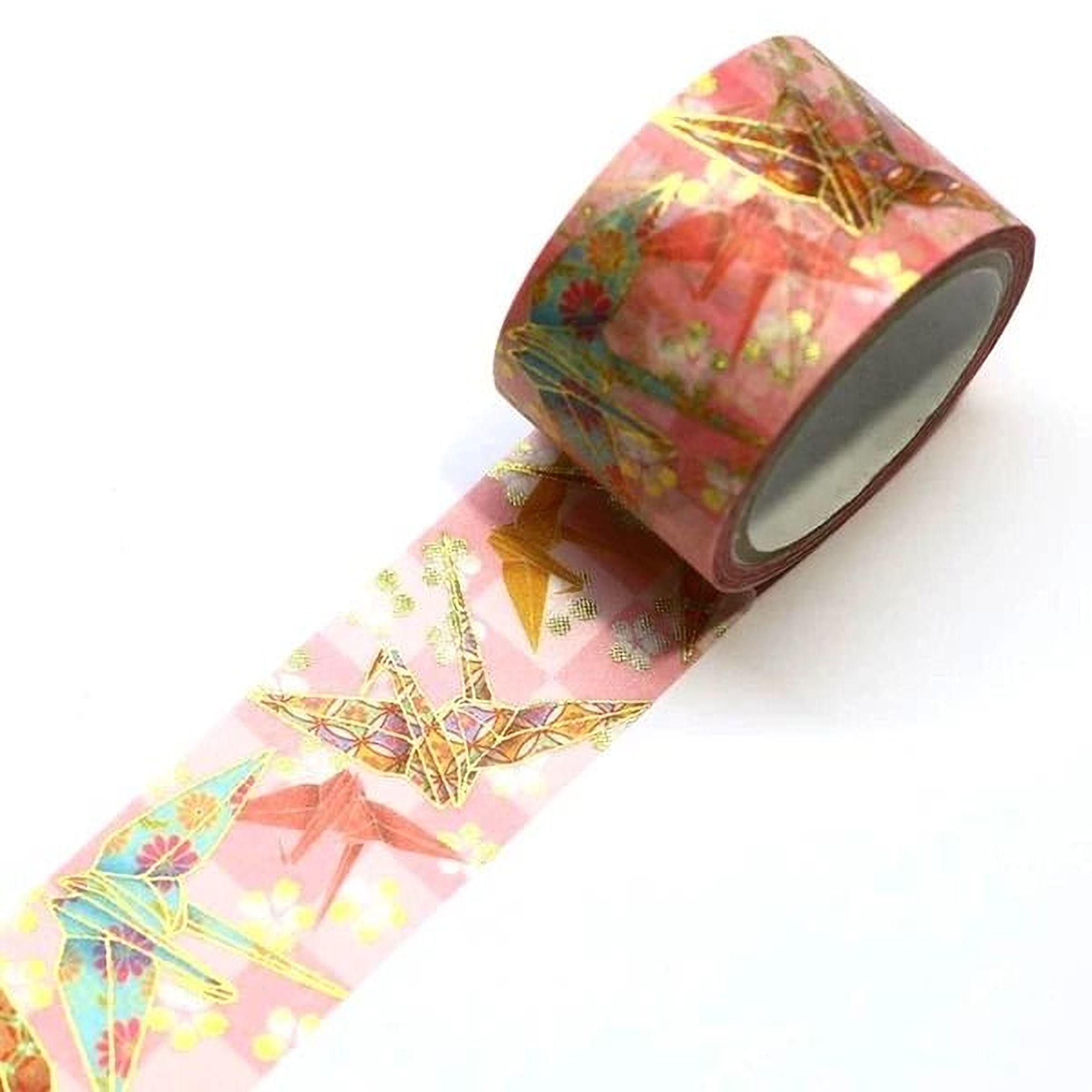 A roll of pink and green patterned tape with a repeating design of colorful birds and flowers.