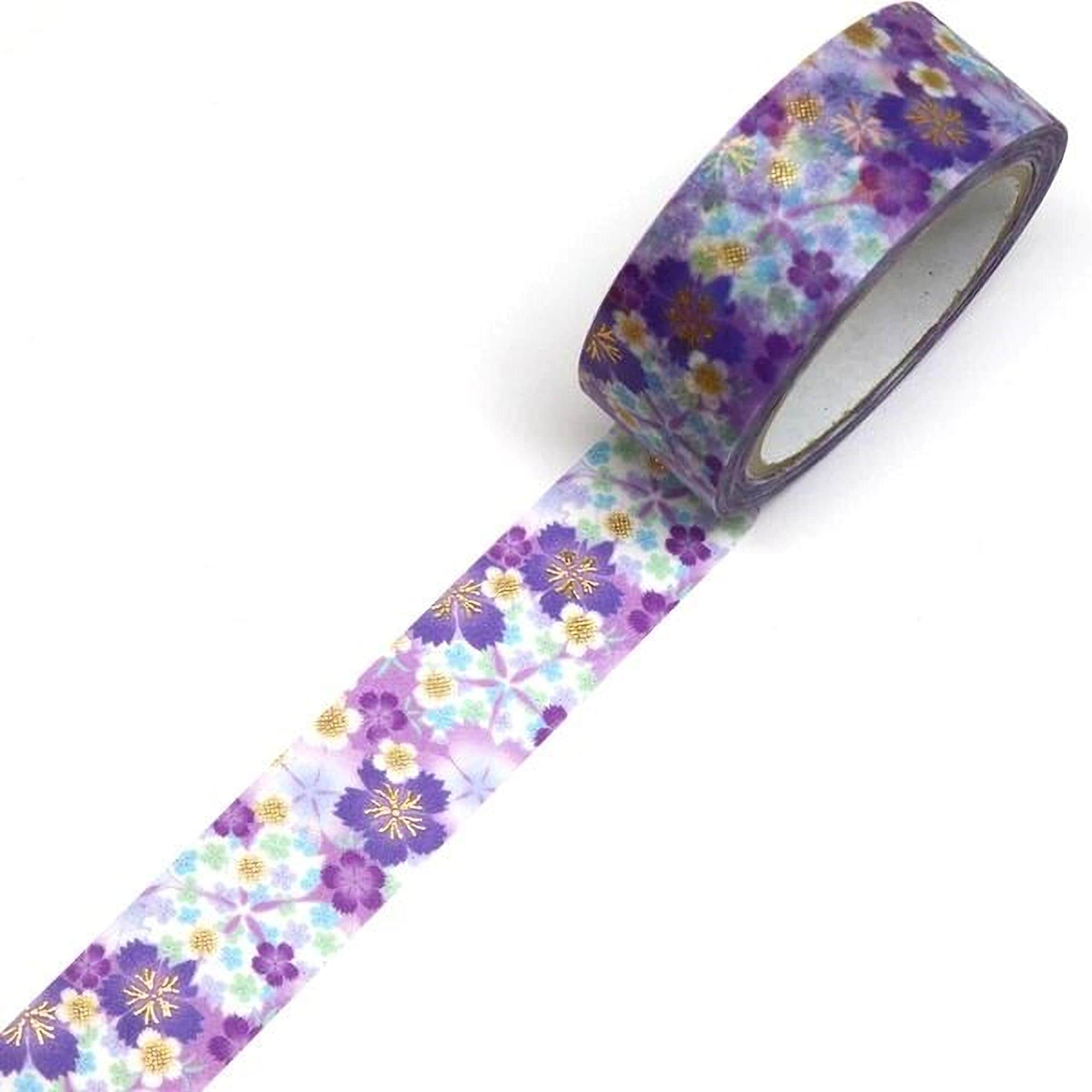 A roll of purple and gold floral patterned tape is lying on a white surface.