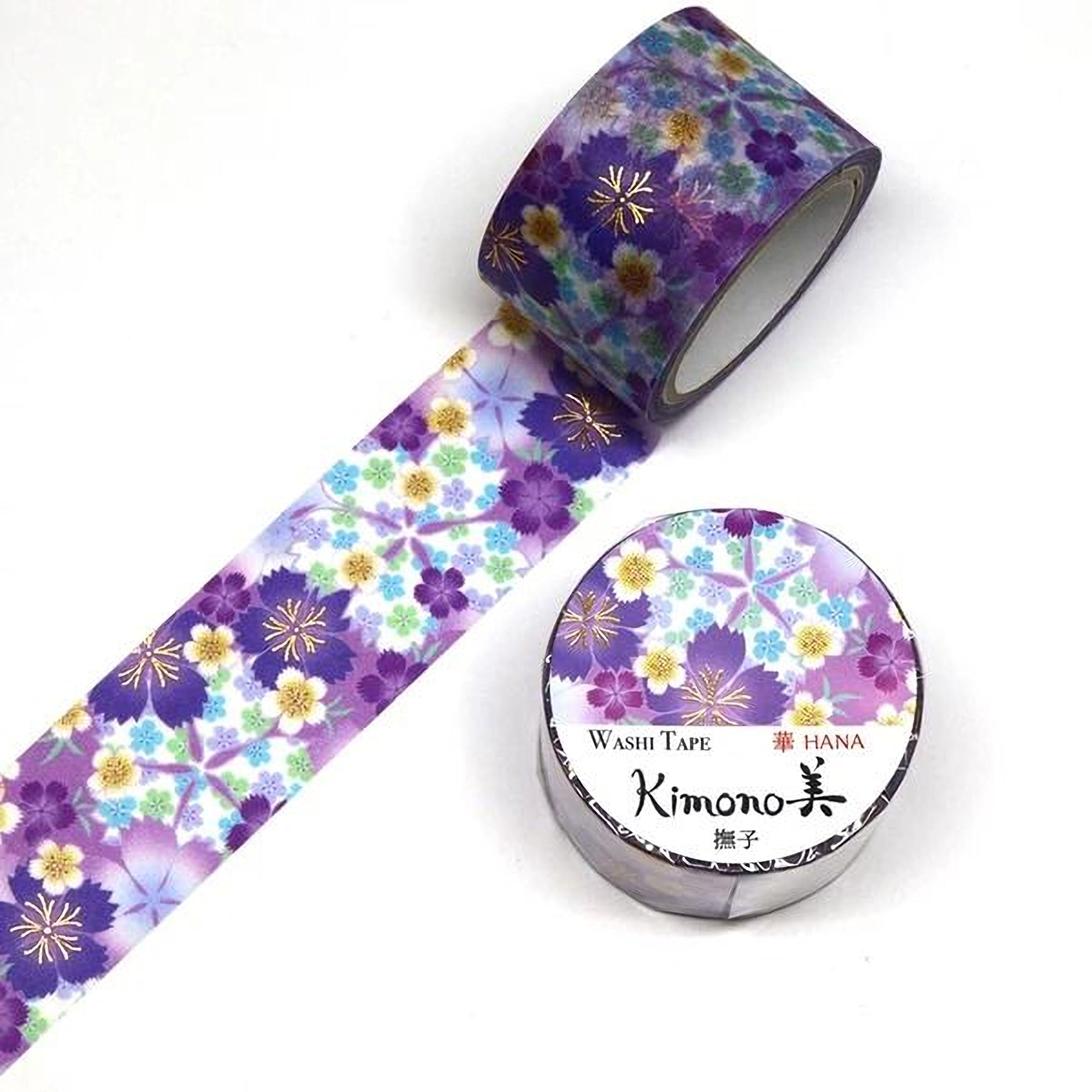a roll of washable, floral-patterned tape and a round container with the brand name "Kimono" printed on it.