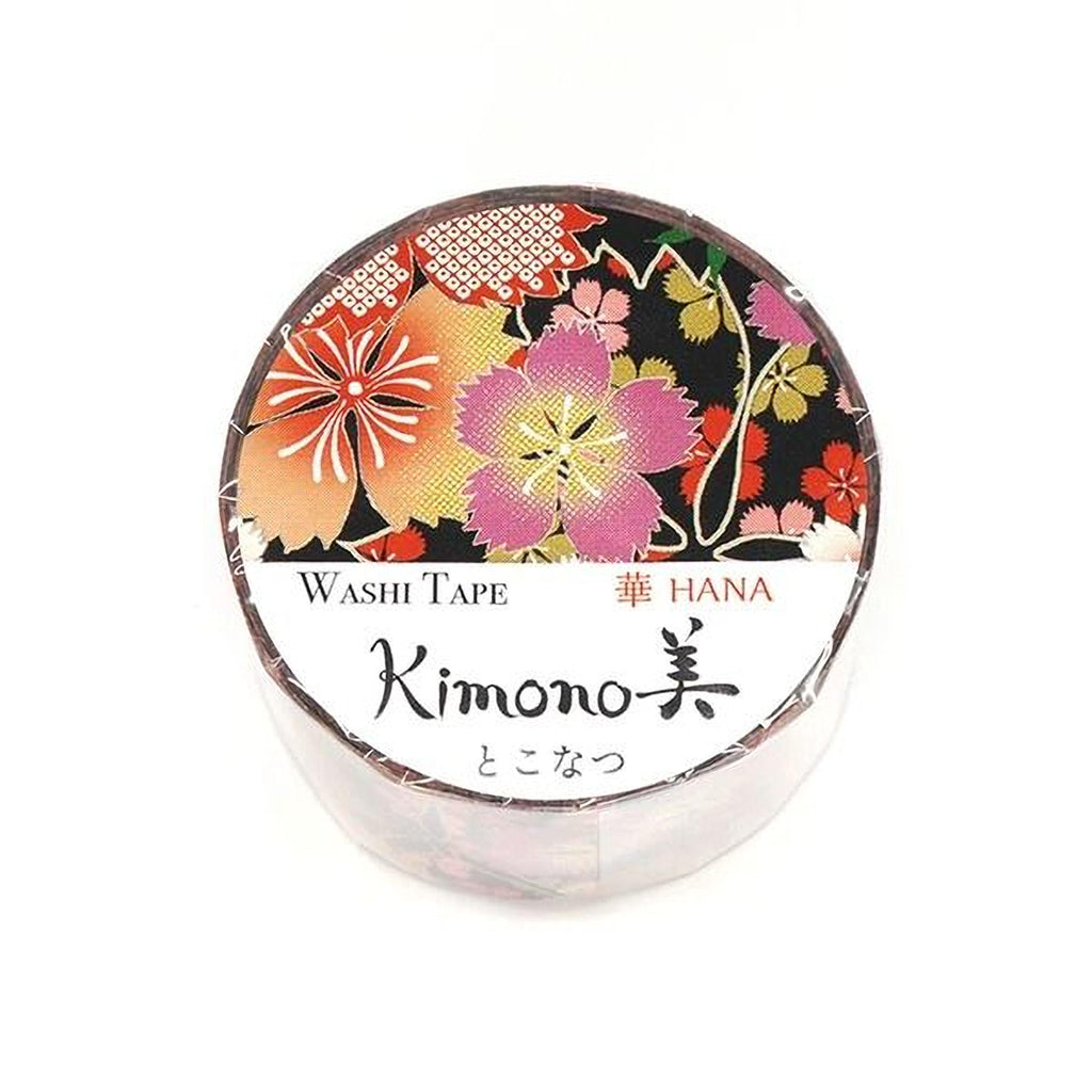 A round, white, and black container with a floral pattern and text, likely a product packaging for a Japanese product called Kimono.