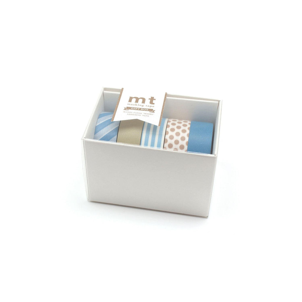 A white box containing four rolls of colorful tape, with a label indicating the contents of the box.