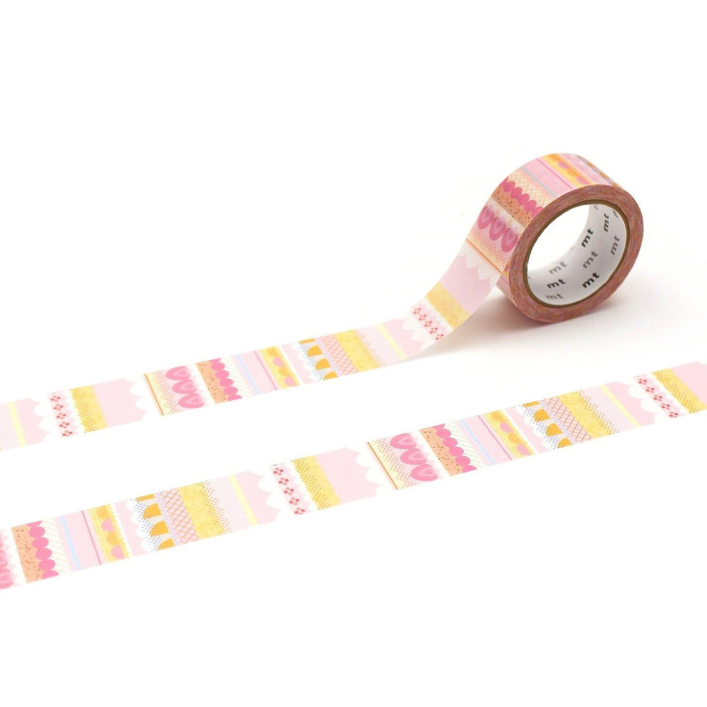 a roll of pink and yellow patterned tape with a decorative design on it.