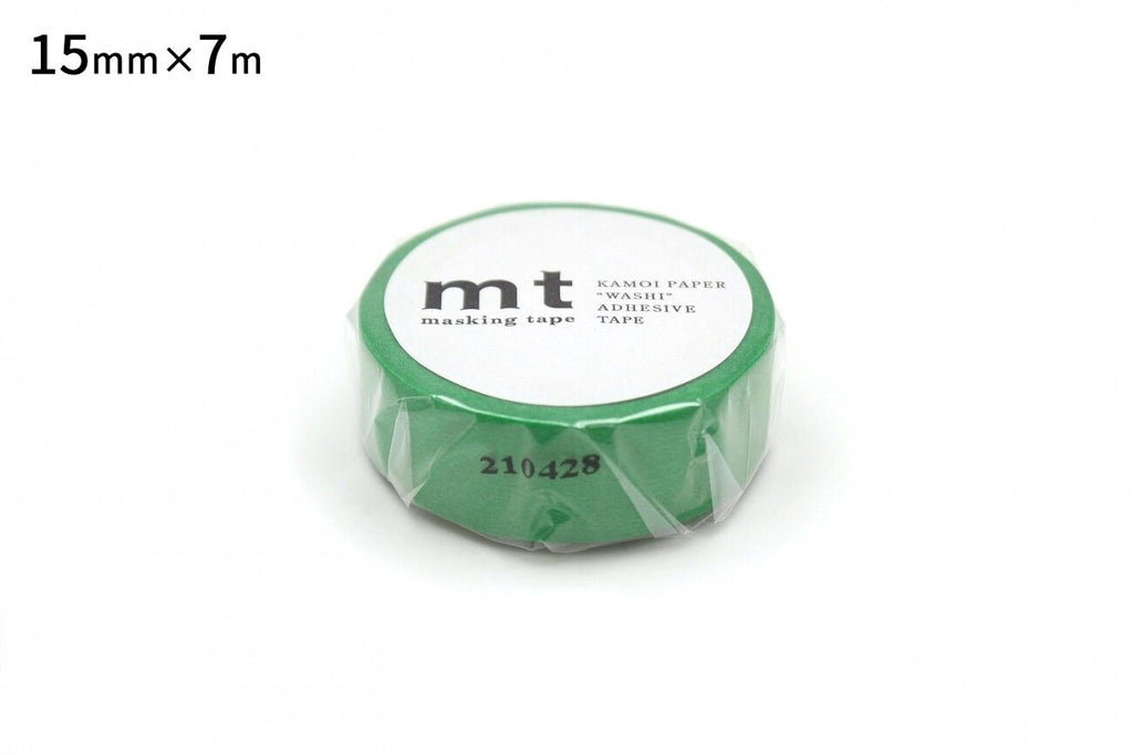A roll of green masking tape with the text "mt" printed on it.
