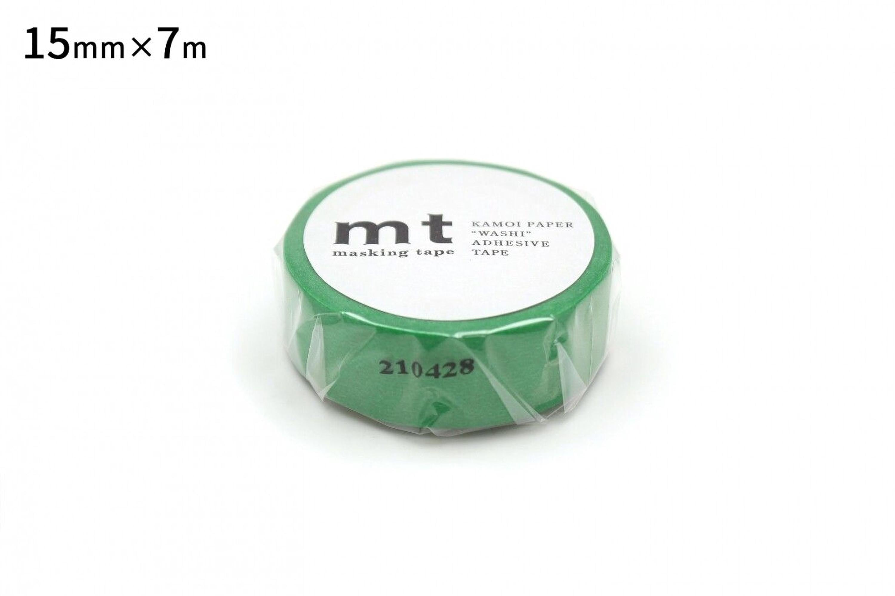 A roll of green masking tape with the text "mt" printed on it.