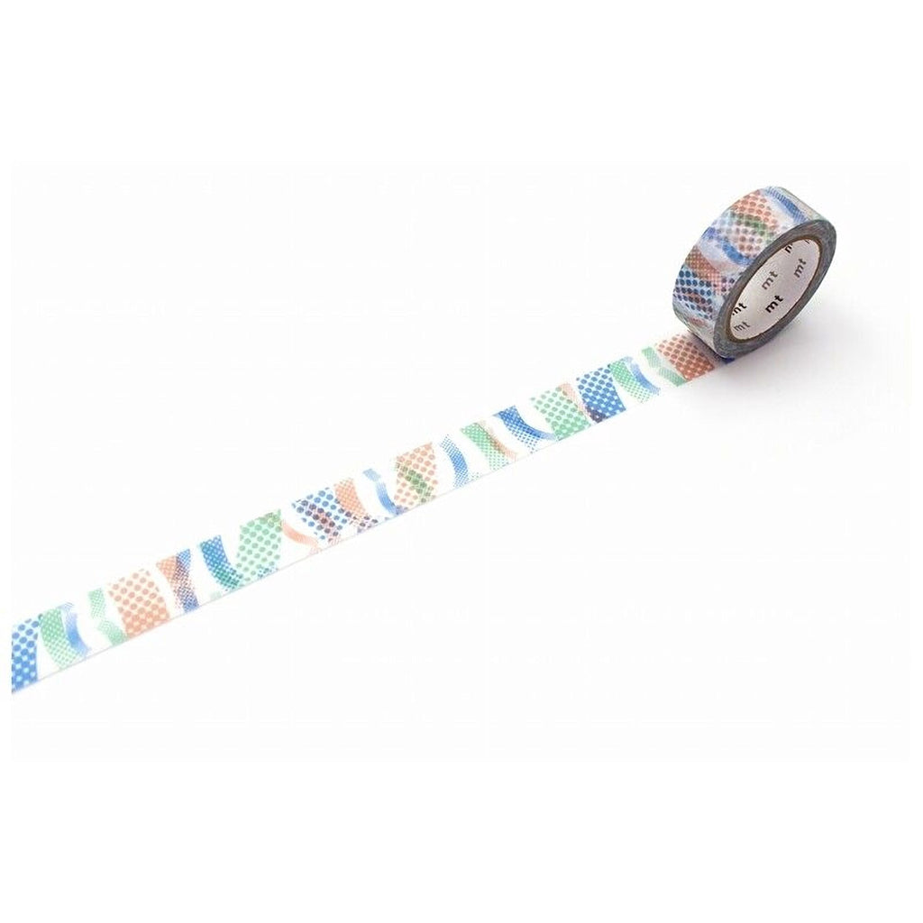 A roll of patterned tape is lying on a white surface, with a colorful design on the tape.