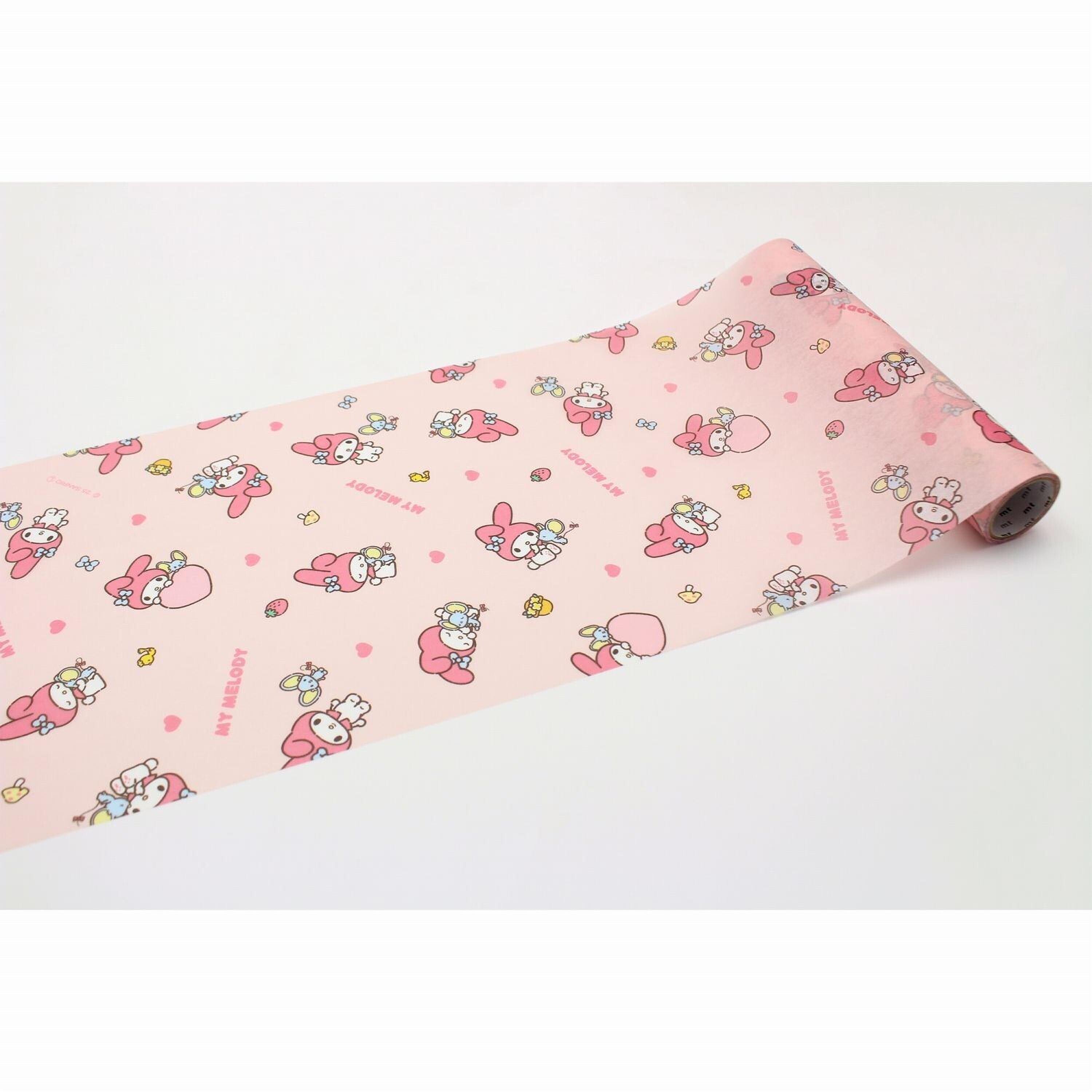 a roll of pink paper with a repeating pattern of cartoon characters, including a pink bunny and other cute, colorful characters.