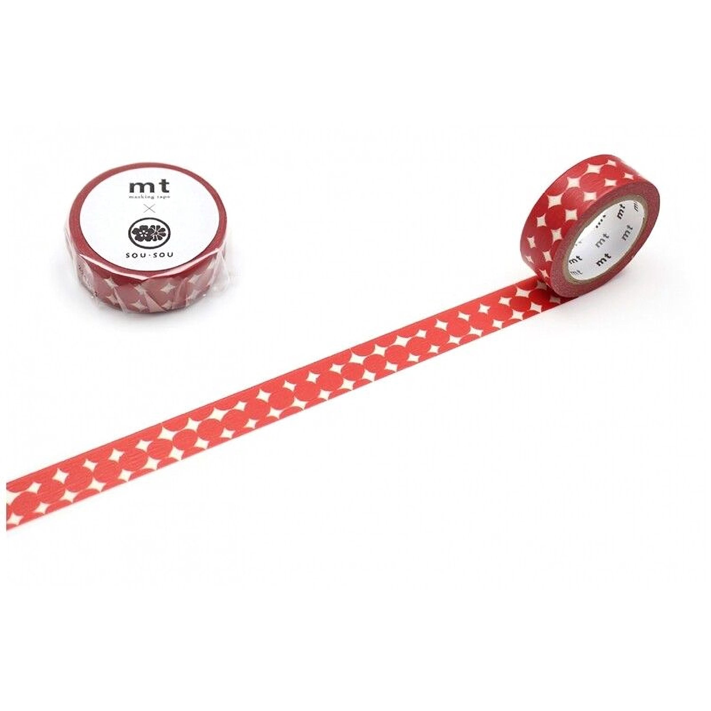 a roll of red and white patterned tape and a red and white patterned tape on a white background.