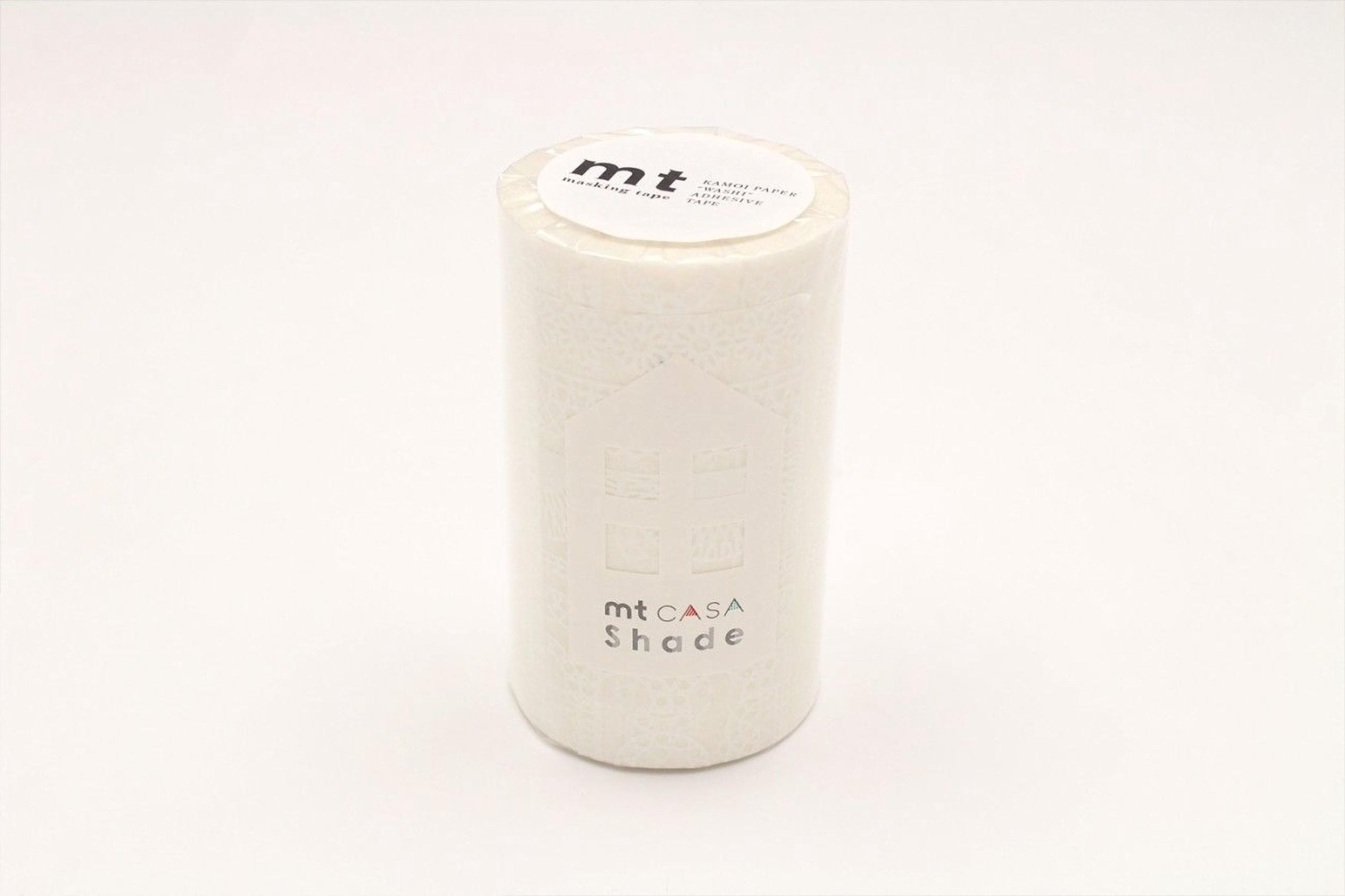 A cylindrical white object with a label on top, sitting on a white background.