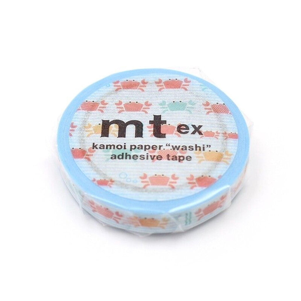A blue and white circular container with a pattern of small crabs printed on it.