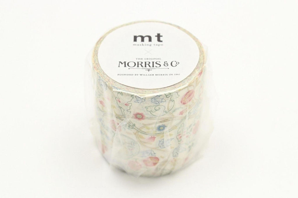 A cylindrical container of masking tape with a floral pattern, featuring the text "mt" and "The Original Morris & Co." printed on it.